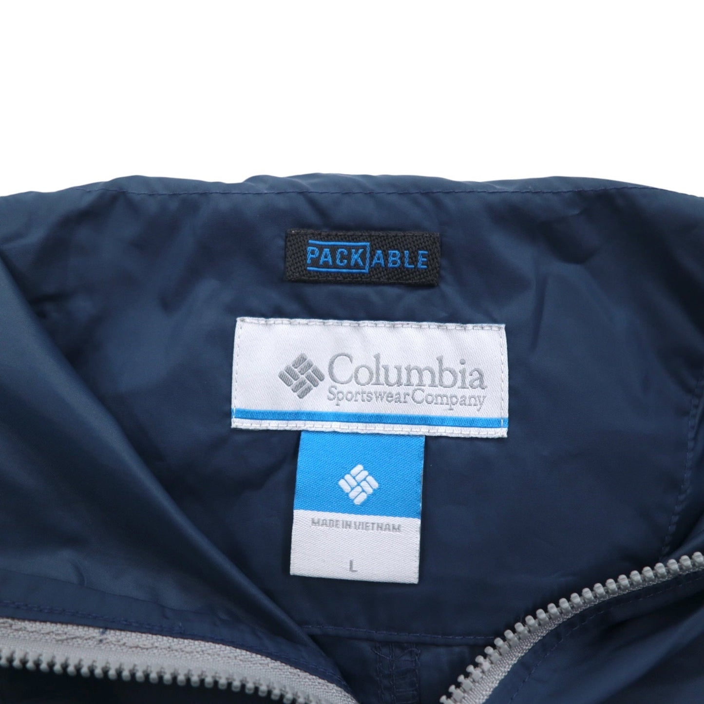 Columbia パッカブル アノラックパーカー レインジャケット L ブルー 総柄 フロントポケット ドローコード WE0043