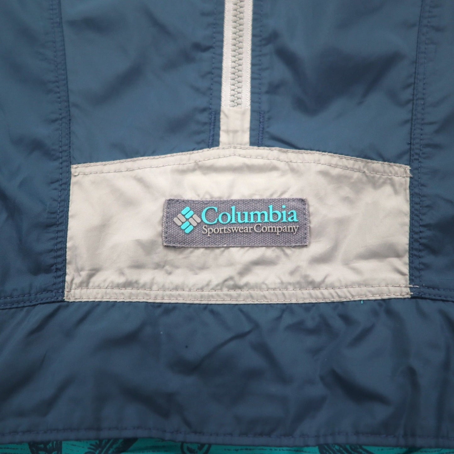 Columbia パッカブル アノラックパーカー レインジャケット L ブルー 総柄 フロントポケット ドローコード WE0043