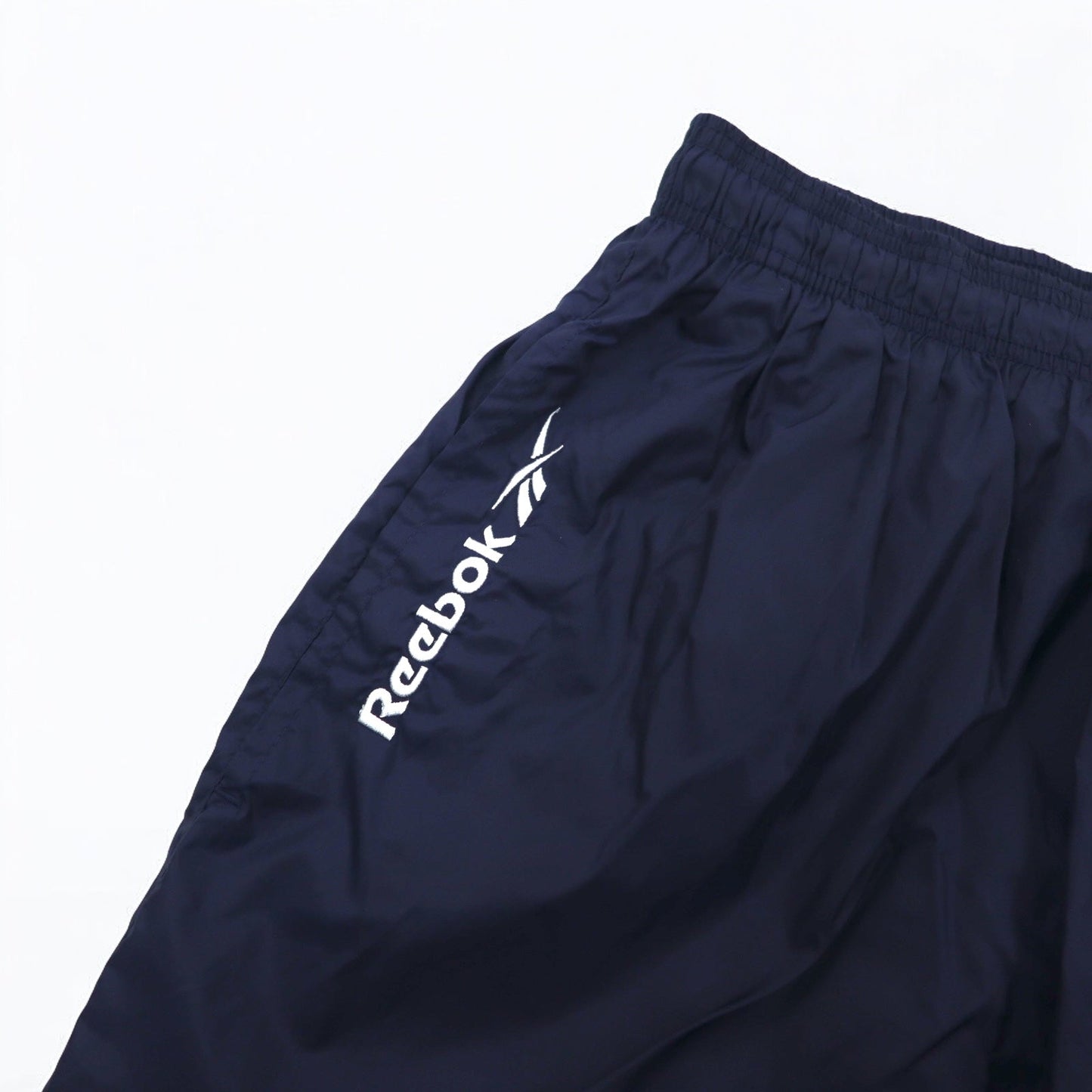 Reebok 90年代 ナイロン トラックパンツ ジャージ L ネイビー ベクターロゴ刺繍 スリット 裾ジップ