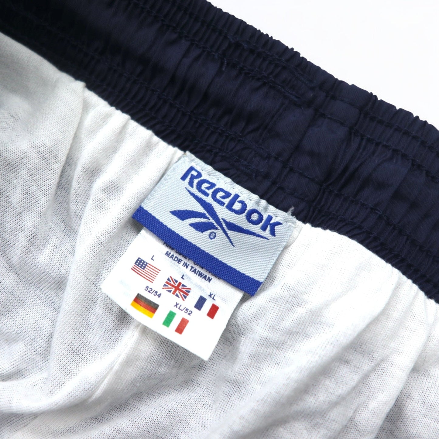 Reebok 90年代 ナイロン トラックパンツ ジャージ L ネイビー ベクターロゴ刺繍 スリット 裾ジップ