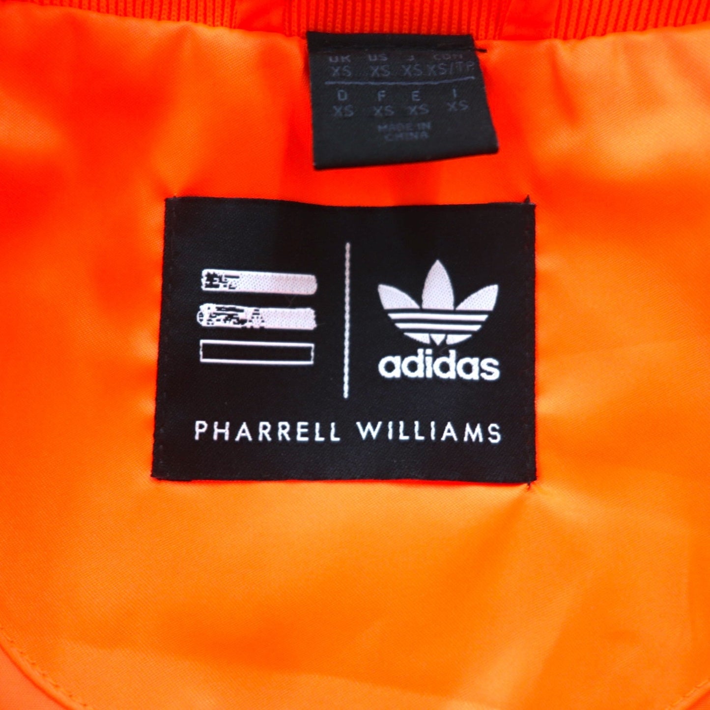 adidas originals × PHARRELL WILLIAMS トラックジャケット ジャージ XS オレンジ スナップボタン トレフォイルロゴ 3ストライプ Z97399