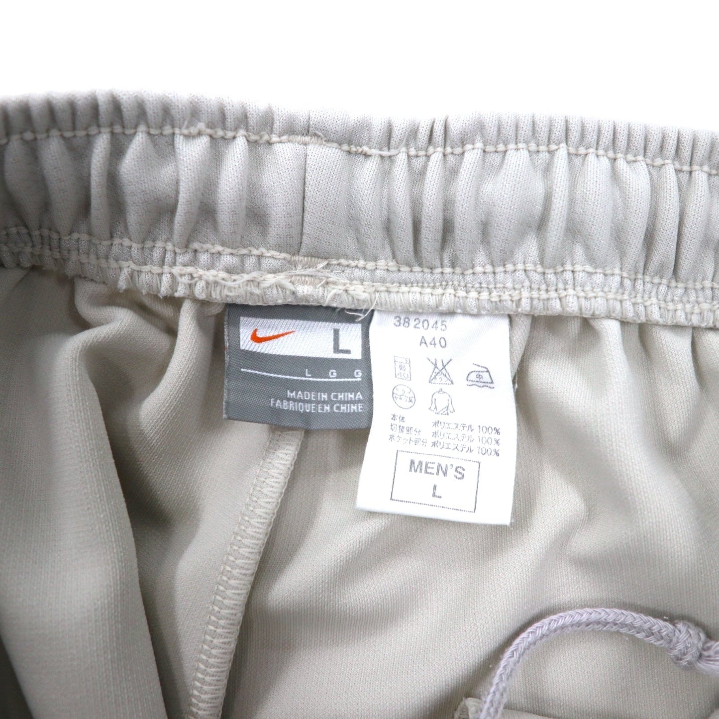 NIKE トラックパンツ ジャージ L ベージュ ポリエステル サイドライン スウォッシュロゴ刺繍