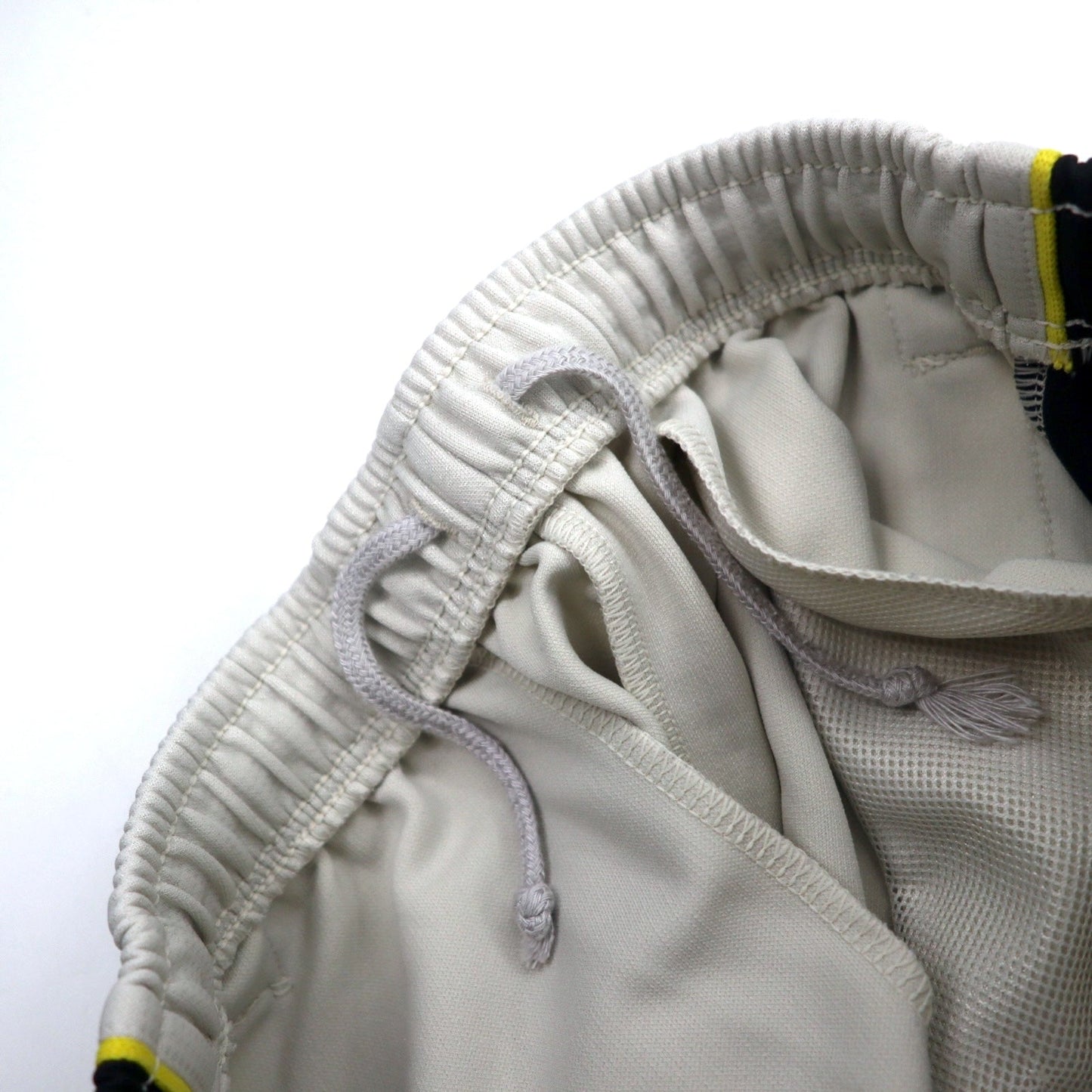 NIKE トラックパンツ ジャージ L ベージュ ポリエステル サイドライン スウォッシュロゴ刺繍