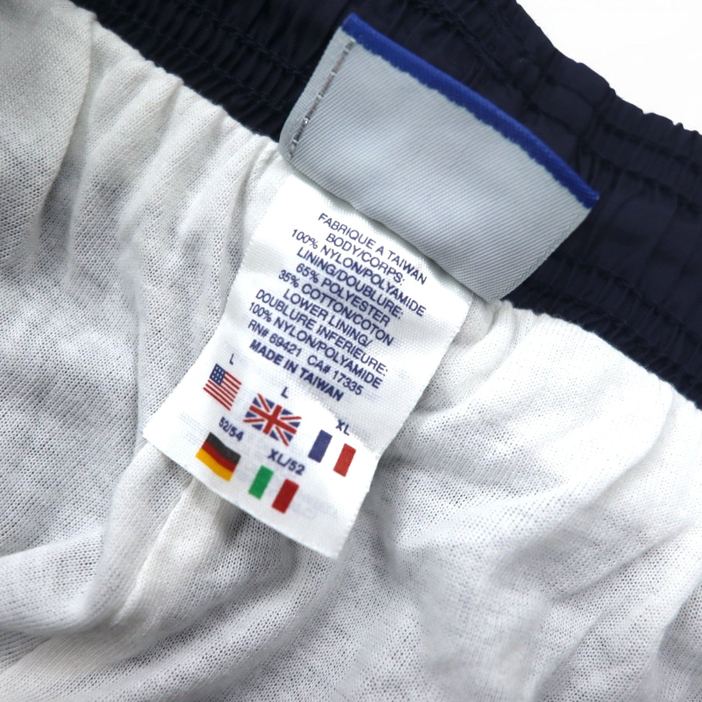 Reebok 90年代 ナイロン トラックパンツ ジャージ L ネイビー ベクターロゴ刺繍 スリット 裾ジップ