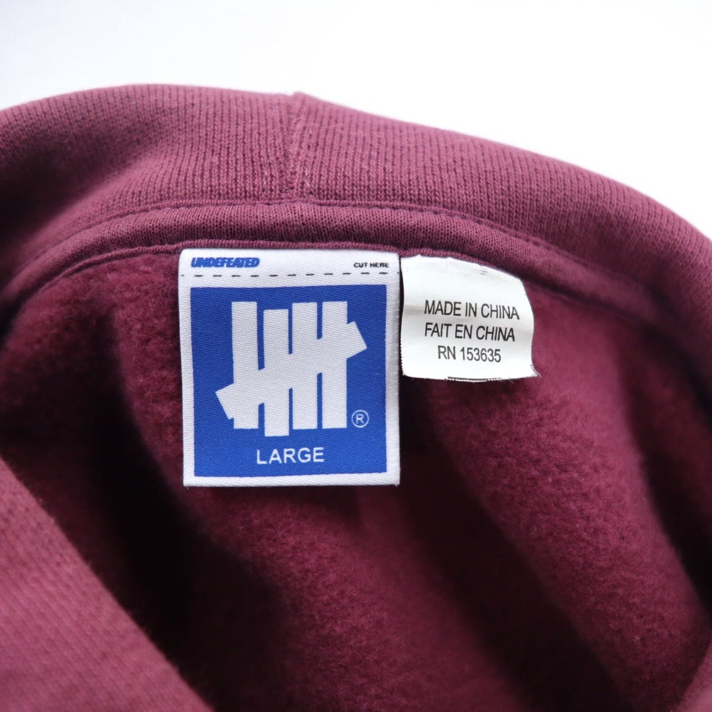 UNDEFEATED ロゴプリント プルオーバー パーカー L ピンク コットン 袖プリント