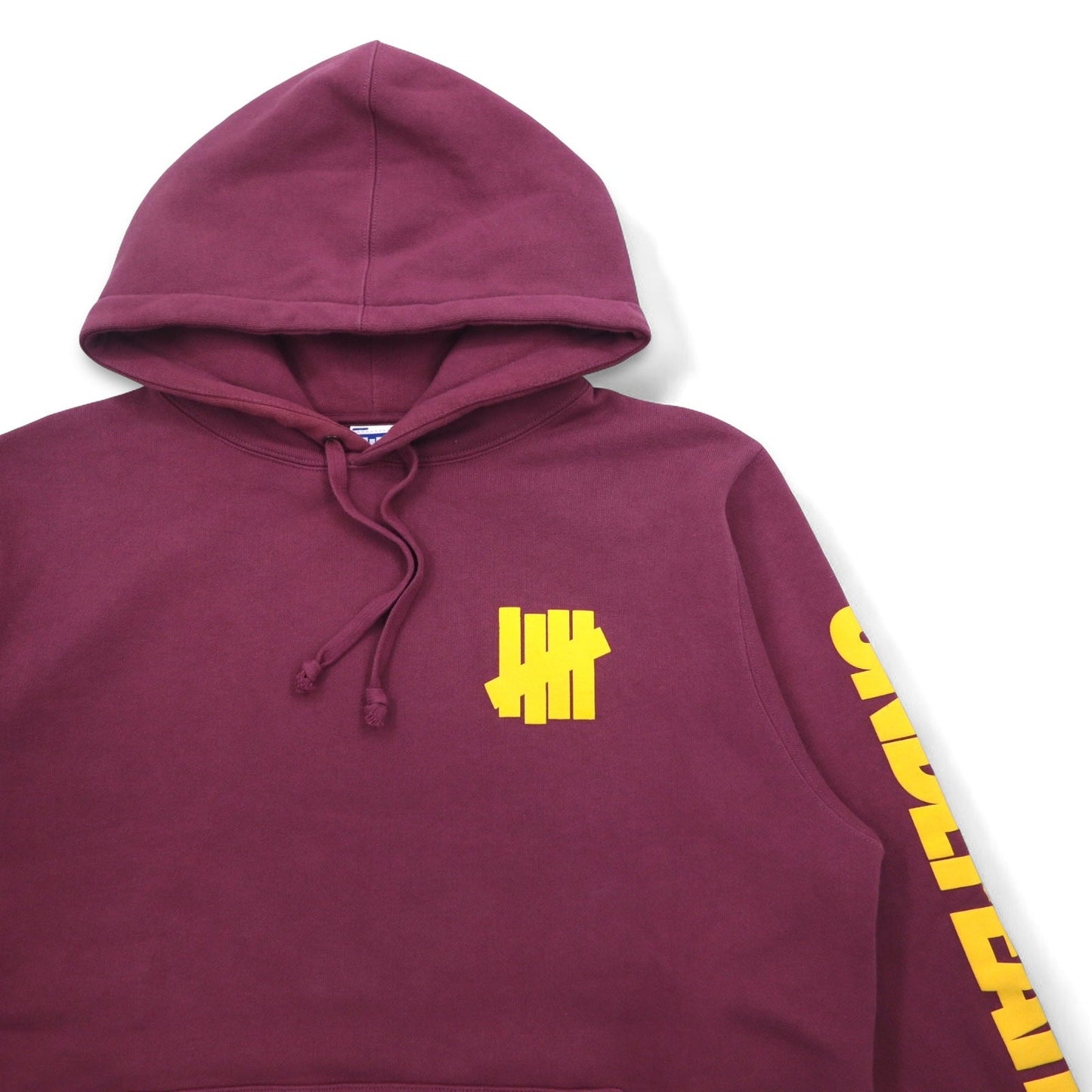 UNDEFEATED ロゴプリント プルオーバー パーカー L ピンク コットン 袖プリント